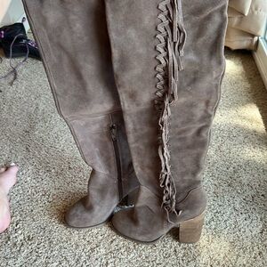 Over the knee or knee-high fringe boots